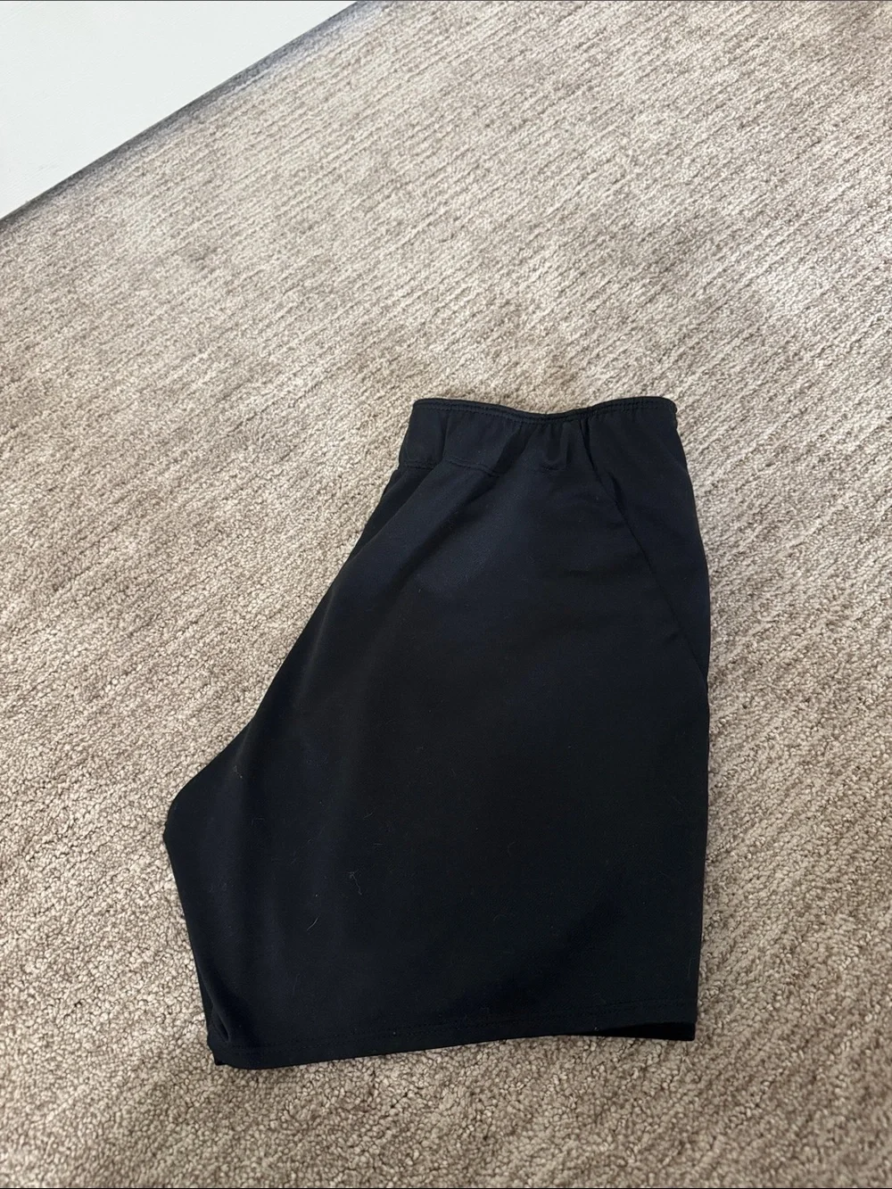 Nike Black Women's Athletic Shorts with White Swoosh and Branded Waistband